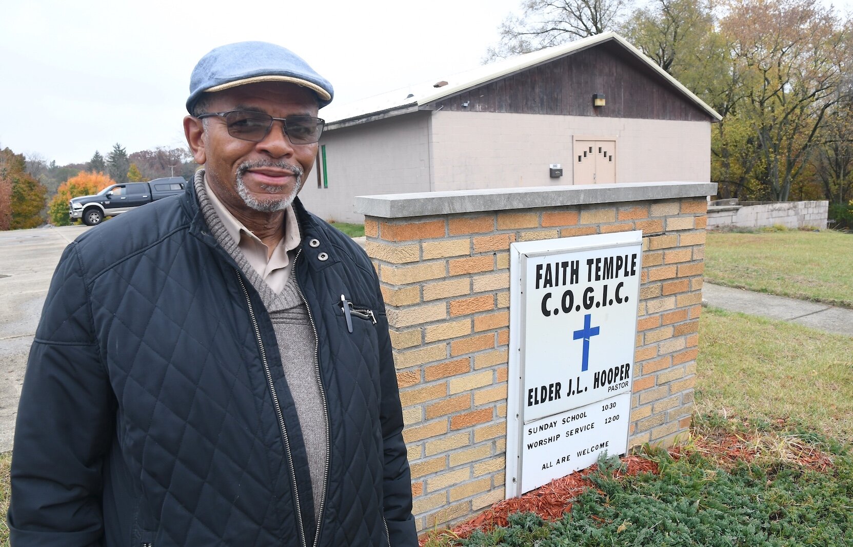 Pastor Joe Hooper stands in front of Faith Temple Church of God in Christ on North Washingon Avenue.