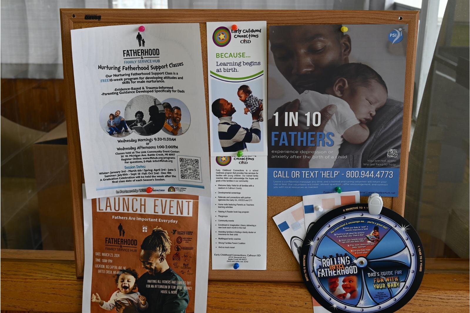  Information about resources for fathers is located on a bulletin board the Fatherhood Family Service Hub on West Michigan Avenue.