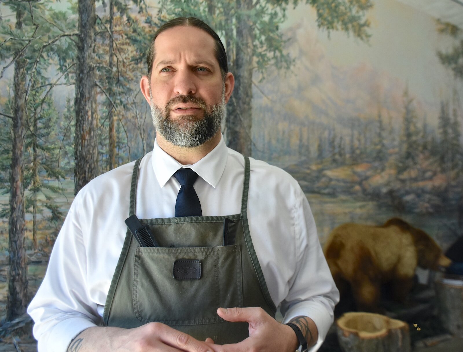 Noah Saber talks about the Huntsman’s Hound Lounge and Camp barber shop in downtown Marshall.