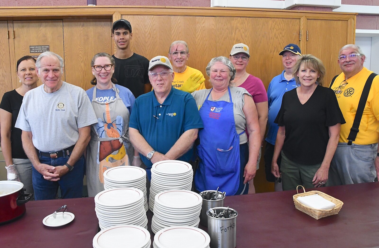 Members of both Battle Creek’s Rotary Clubs volunteer for St. Thomas Episcopal Church’s breakfast program.