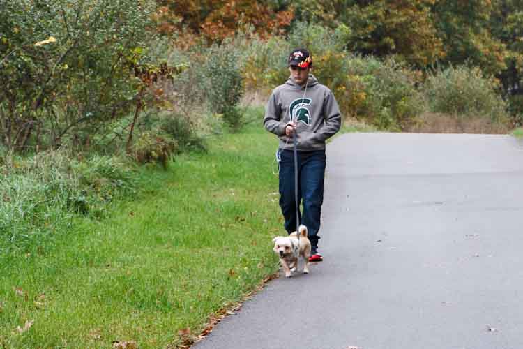 Damian Diamante started his own dog walking business. Photo by Susan Andress