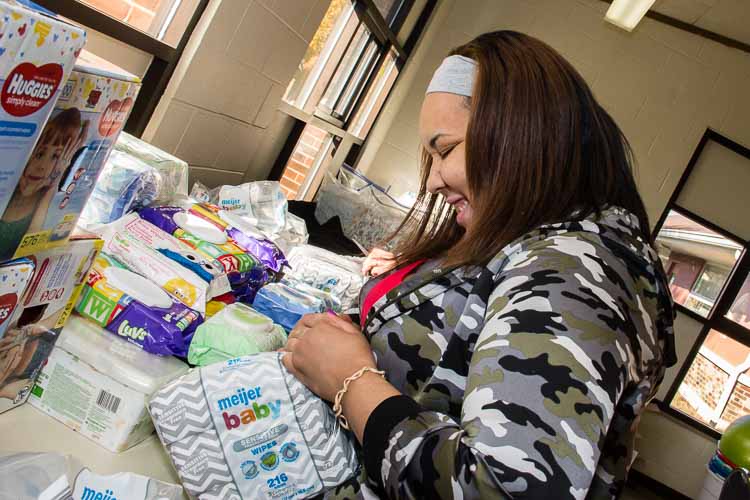 Aliyah finds the right size diapers for family at a recent diaper distribution at Parkway Manor.
