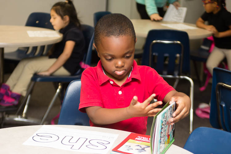 in the kindergarten and first grade after-school program students continue their reading and writing lessons.