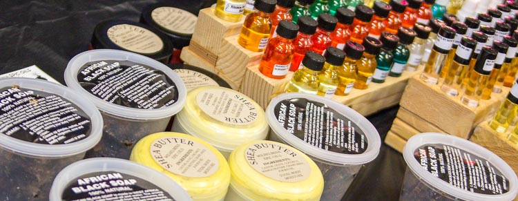 A vendor displayed products, including shea butter and scented oils, at the Northside Art Hop.