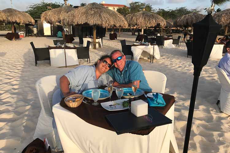  Lee and Lori Taylor enjoy an oceanside anniversary dinner in the Aruban sand. 