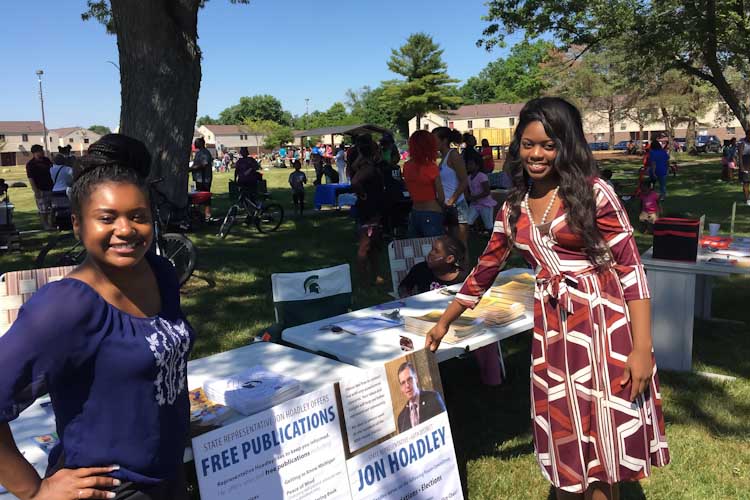 Demetria Webster (left) and Chiante' Lymon staffing an information table at the Interfaith Homes. Both were Sally Appleyard fellows for the DSO in 2016. 