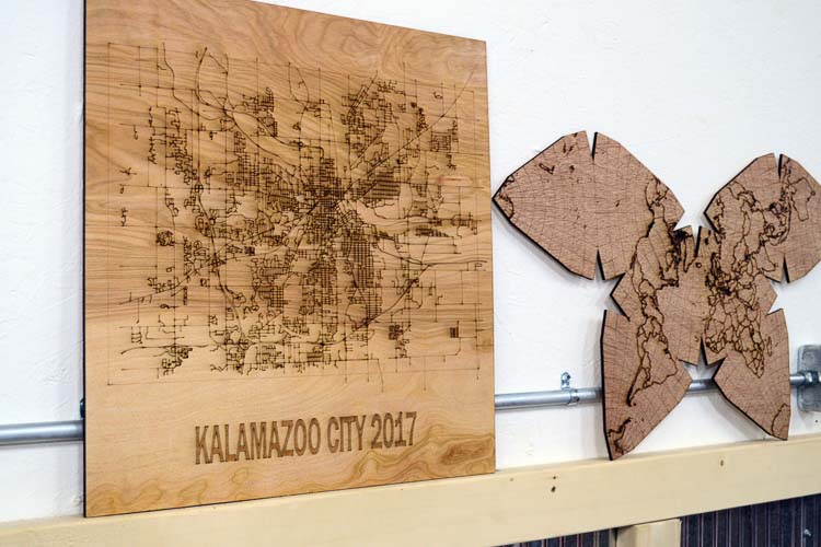 Laser-etched map of Kalamazoo and world.