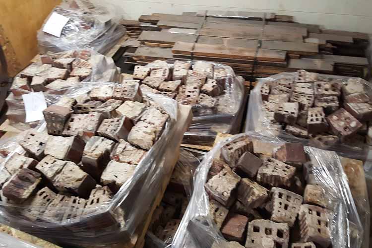 Pallets of bricks from the stack the community is trying to save