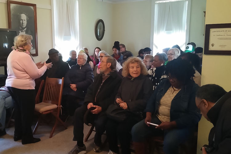 Nancy Rafferty speaking to the group at the Nathan Thomas Underground Railroad House in Schoolcraft in 2016.