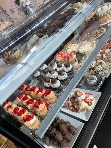 A refrigerated case inside Simply Sensational Berries at 80 West Michigan Avenue is filled with a huge variety of sweet treats to choose from.