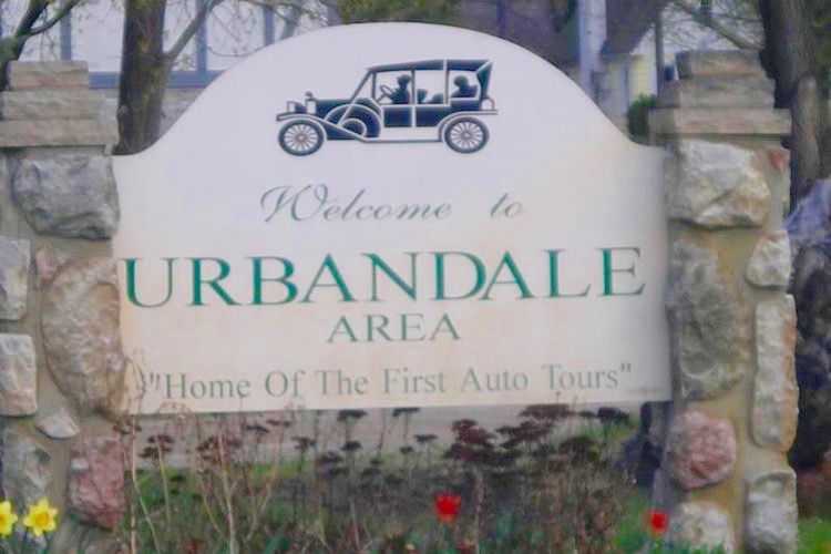 Signs proclaiming Urbandale as the "Home of First Auto Tour" have an interesting history.