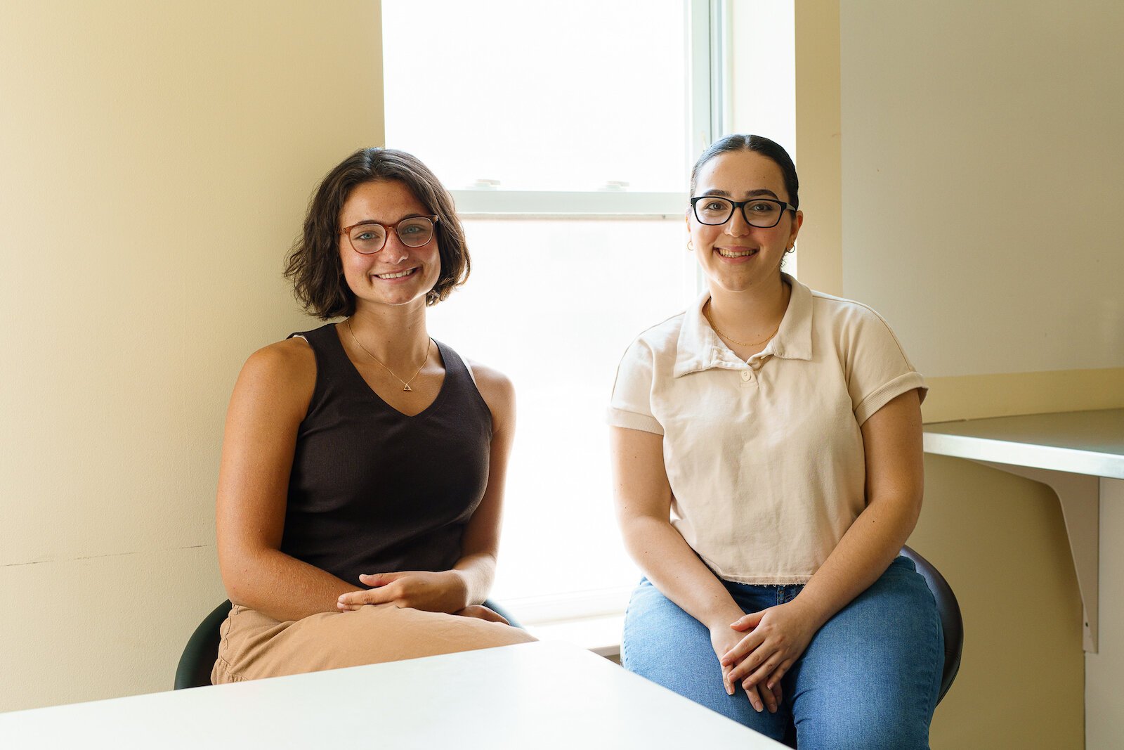Danielle DeVine (left), Haila Jiddou (right) are the first interns for Synergy Health Center, which started offering programs for youth seven years ago.
