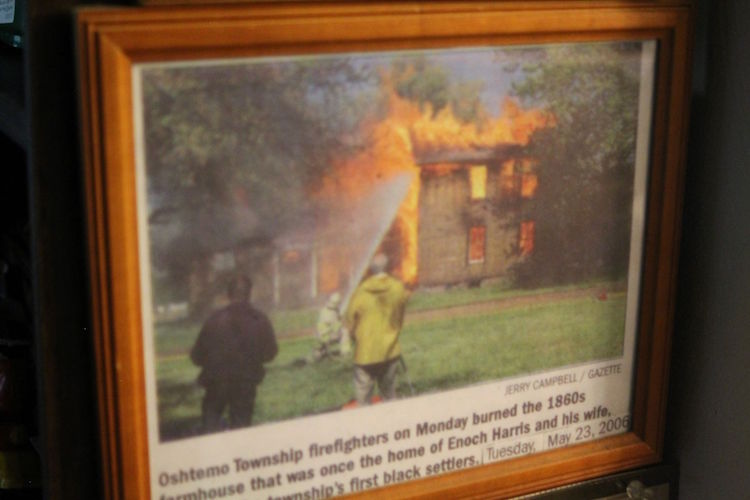 Capturing the history of the burning of the home of Oshtemo’s first black settlers Enoch and Deborah Harris as firefighters practiced putting out a blaze.