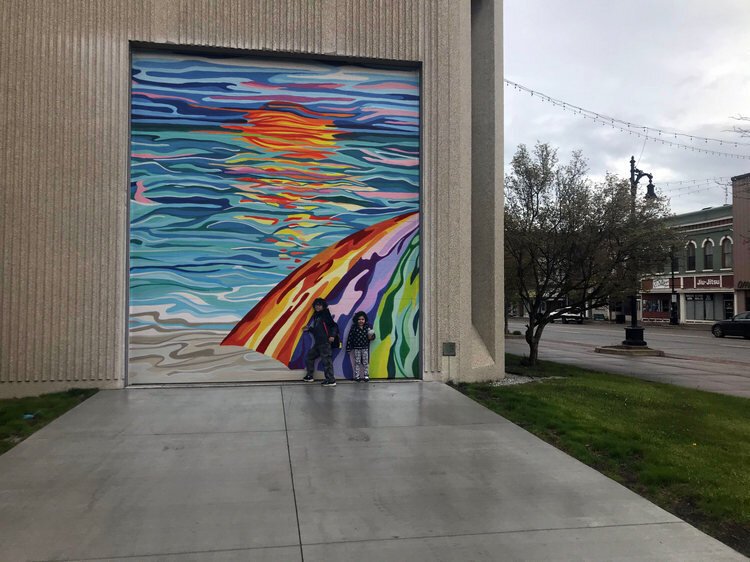Laura DeNault's winning piece, Photoshopped on the side of the Michigan Mutual building