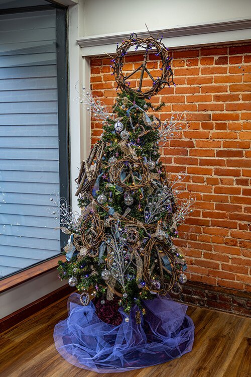 The Peace on Earth themed Christmas tree by Contance Gutenkunst is located at Megan Simmons State Farm on Huron Avenue in downtown Port Huron.