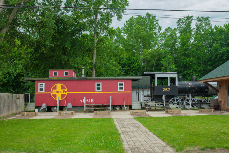 Train cars add ambiance and a place for patrons to hang out at the Adair Bar.