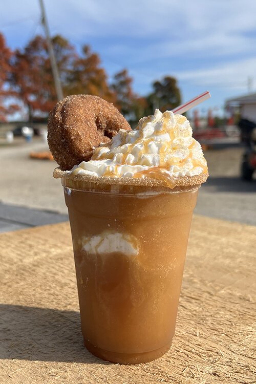 Topped with whipped cream, caramel, and a cinnamon sugar donut, the Cider Slushy is a popular offering at McCallum's.