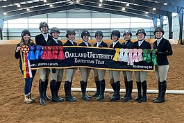 Oakland University's equestrian team poses for a photo.