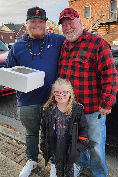 Alex Martin (left) with his grandfather and daughter.