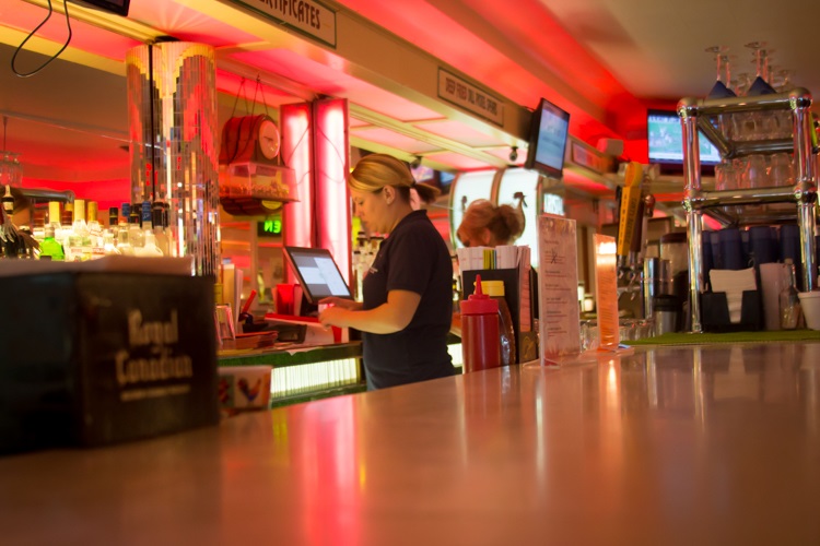 Grab a drink and some tasty chicken at Palms Krystal Bar