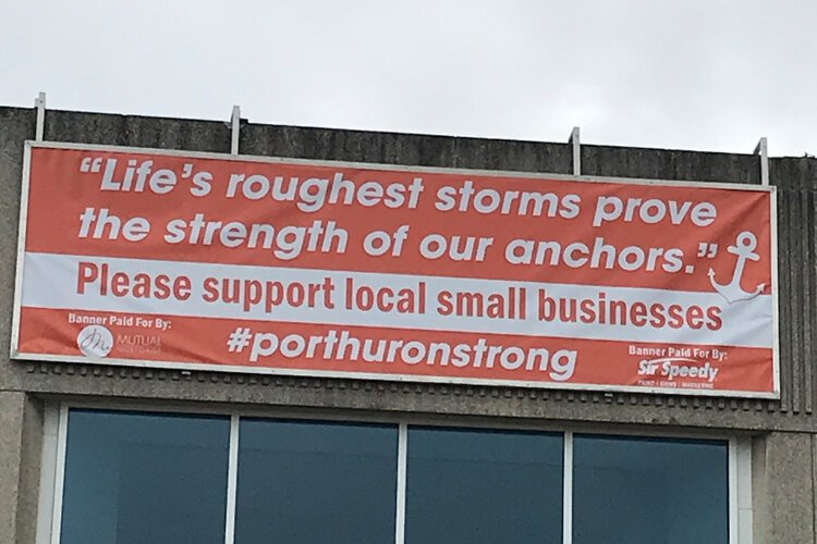 Lisa Bowman and her team designed a sign to be displayed throughout the city, complete with a #PortHuronStrong hashtag and an inspirational quote.