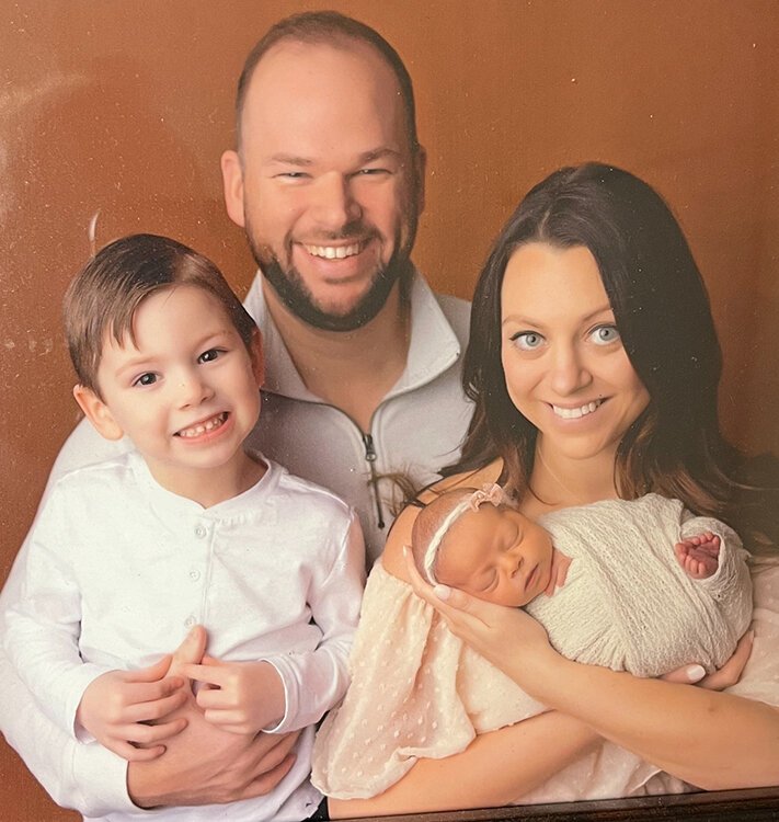 Robert and Ashley Wilkinson with their two children Benny (left) and Addie.
