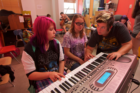 Youth learn basic music skills and how to perform.