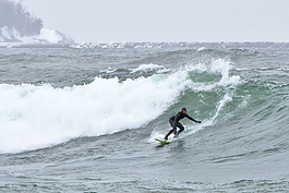 Dan Schetter taking advantage of some big surf in April, Lake Superior Marquette