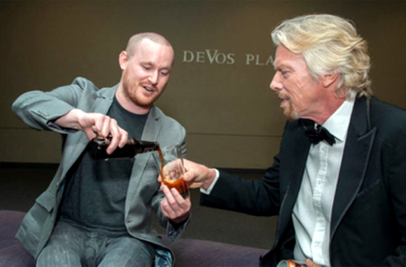 Bugsy Sailor pours a cold one with Richard Branson. 