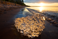 last of the ice? Lake Superior gold reflections at sunset | Shawn Malone