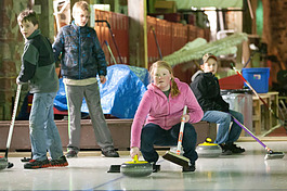 Youth learning to curl in Calumet Township in the Drill Shop.