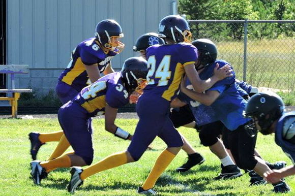 Rapid River scrimmages Superior Central early in the 2015 8-man football season.