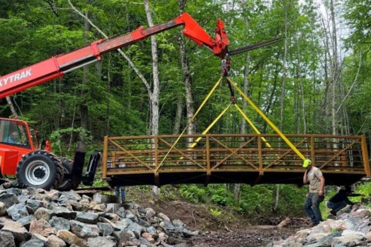 A new bridge connecting Black River Harbor and Black River Campground being installed in September 2022.