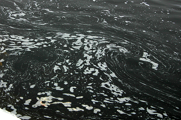 Water swirls near the mouth of the Manistique River. 