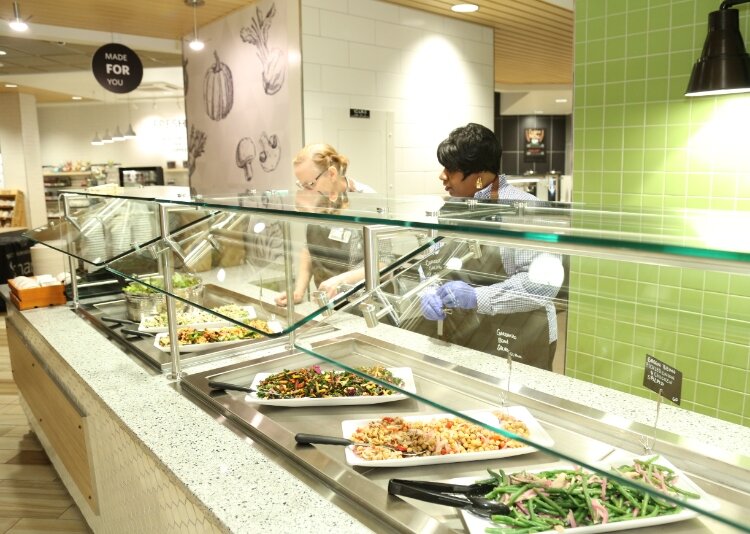 Staff serve up food at Corewell Health's The Green Beet.