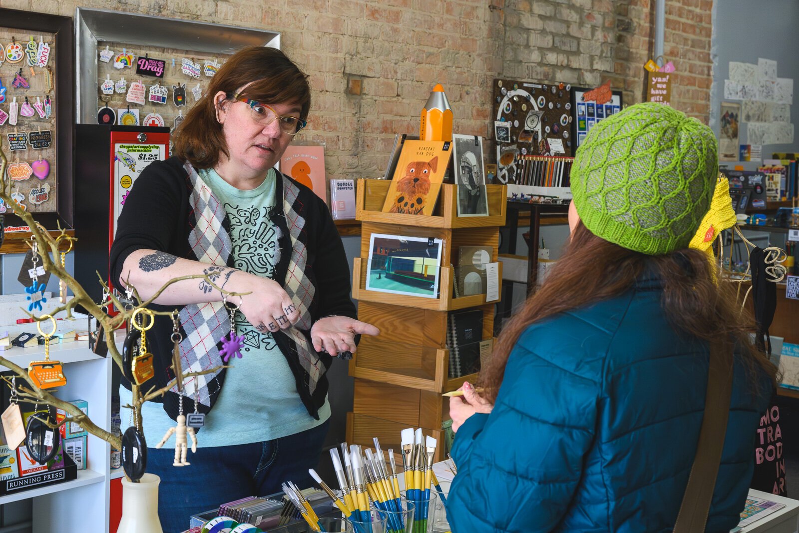 Ypsi Art Supply and Atelier owner Megan Foldenauer talking with a customer.