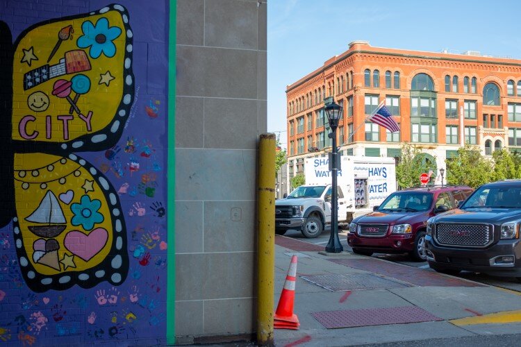 The United We Go murals are in an alley near the intersection of Washington and Center avenues in the heart of Downtown Bay City.