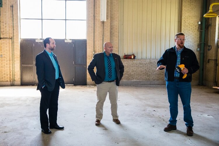 From left, Trevor Keyes of Bay Future, Glenn Rowley of Bangor Township, and Steven Black of RiversEdge, answer questions about the building's history and potential in the future.