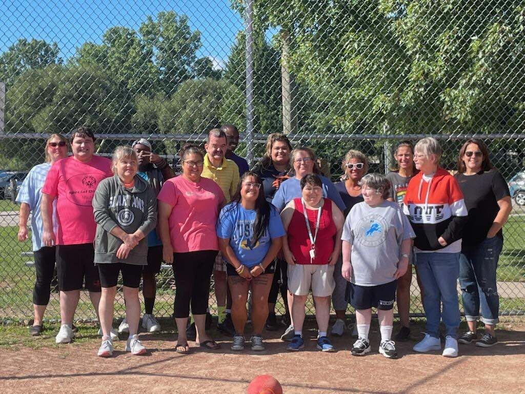 People supported by Blue Water Developmental Housing and employees at a soccer game