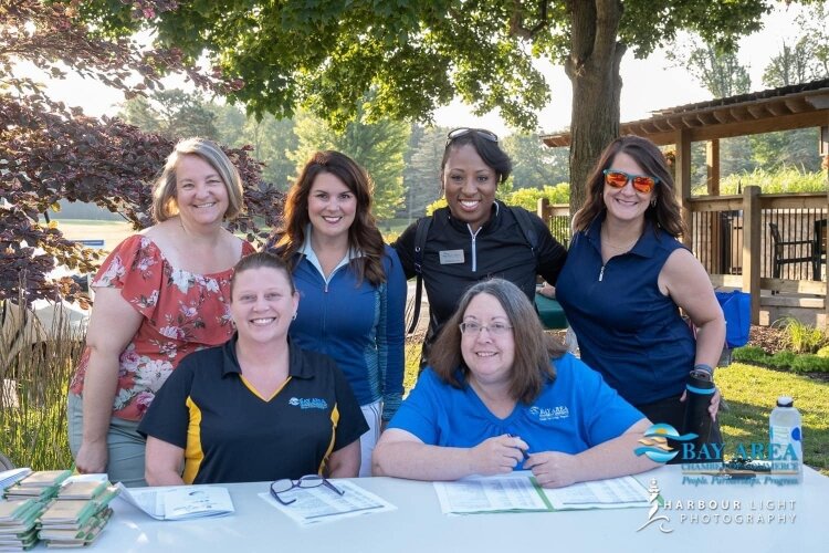 Some of the Chamber staff at the 2022 Golf Outing. From left, back row are Jodi LaMont, Magen Samyn, Marlana Cork, and Breanna Theisen. From left, front row, are Renee Schwartz and Leann Harrison.