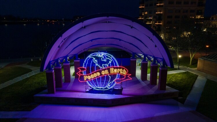 Wishes for Peace on Earth light up Wenonah Park from the stage of the recently-renovated bandshell.