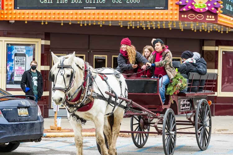 For years during Sundays in the City, free carriage rides step off from outside the State Theatre of Bay City, 913 Washington Ave. This group enjoyed a ride in 2020.