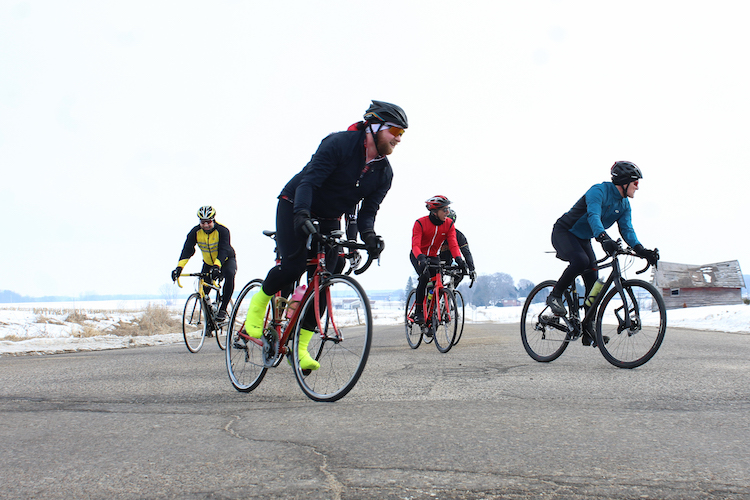 A group of cyclists rides through Mount Pleasant on March 9, 2019.