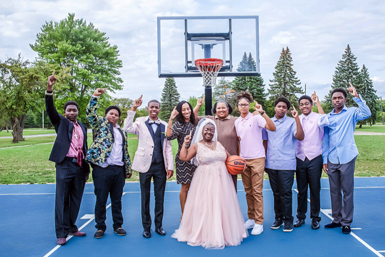 Dakari Thomas at Rouge Park with his mother Tracey Jackson (center), Lisa Bryant, and the team he's played basketball with since he was six years old. 