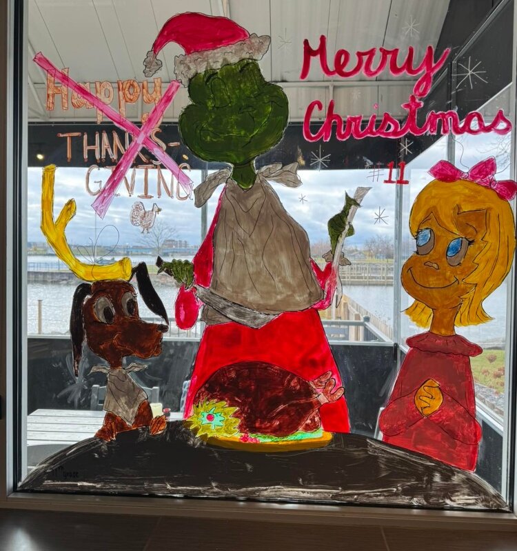 Elyse Hompstead painted the Grinch eating a turkey with Cindy Lou Who and his dog, Max, at H2O's. Her efforts earned her second place in the contest. (Photo courtesy of H2O's Waterside Grill)
