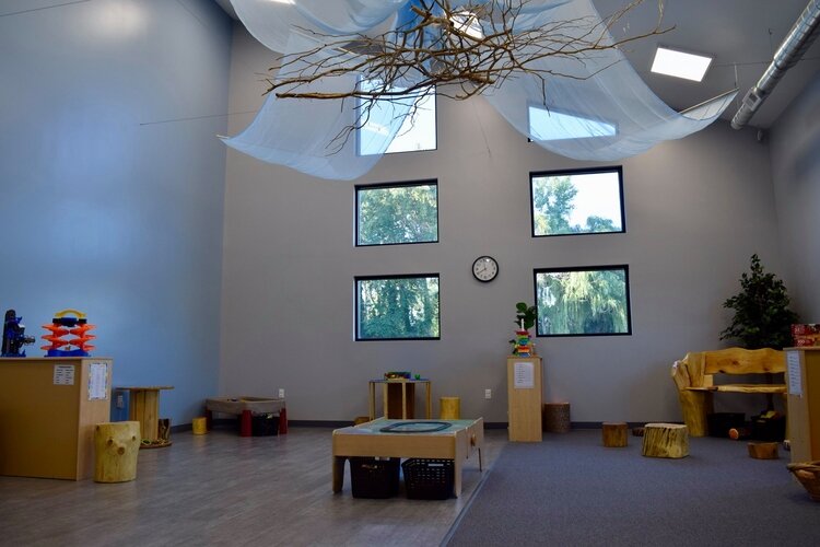 The new 8,000-square-foot Encompass Therapy Center building features large play rooms, therapy rooms, a kitchen, and an on-site playground.