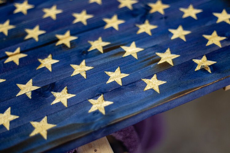 All of Johnston’s work is hand-made – down to the littlest of details. The stars in his wooden American flags are carved with a dremel and handsaw.
