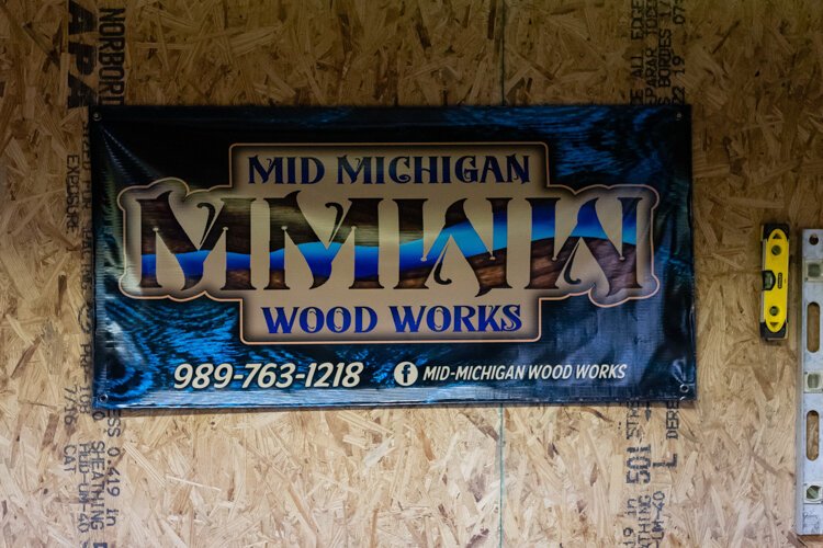 Mid Michigan Wood Works’ logo incorporates the exact river pattern Johnston placed in his first piece.