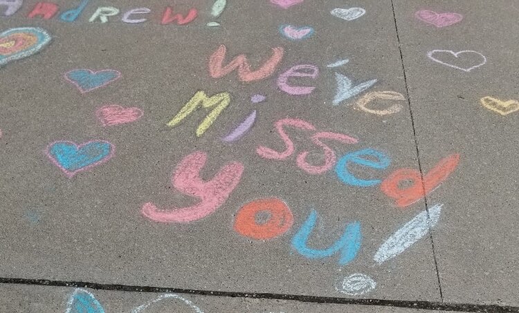 Joanne Weiler-Piechotte left a message for her grandson in the driveway. His family drove to her home to deliver a mask, but the grandparents couldn’t step out to visit him in person.