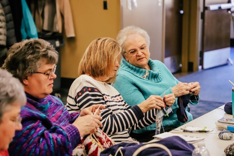 Jan VanNostrand, at right, leads the group of crafters. People of all skill levels are welcome at the Tuesday morning meetings.